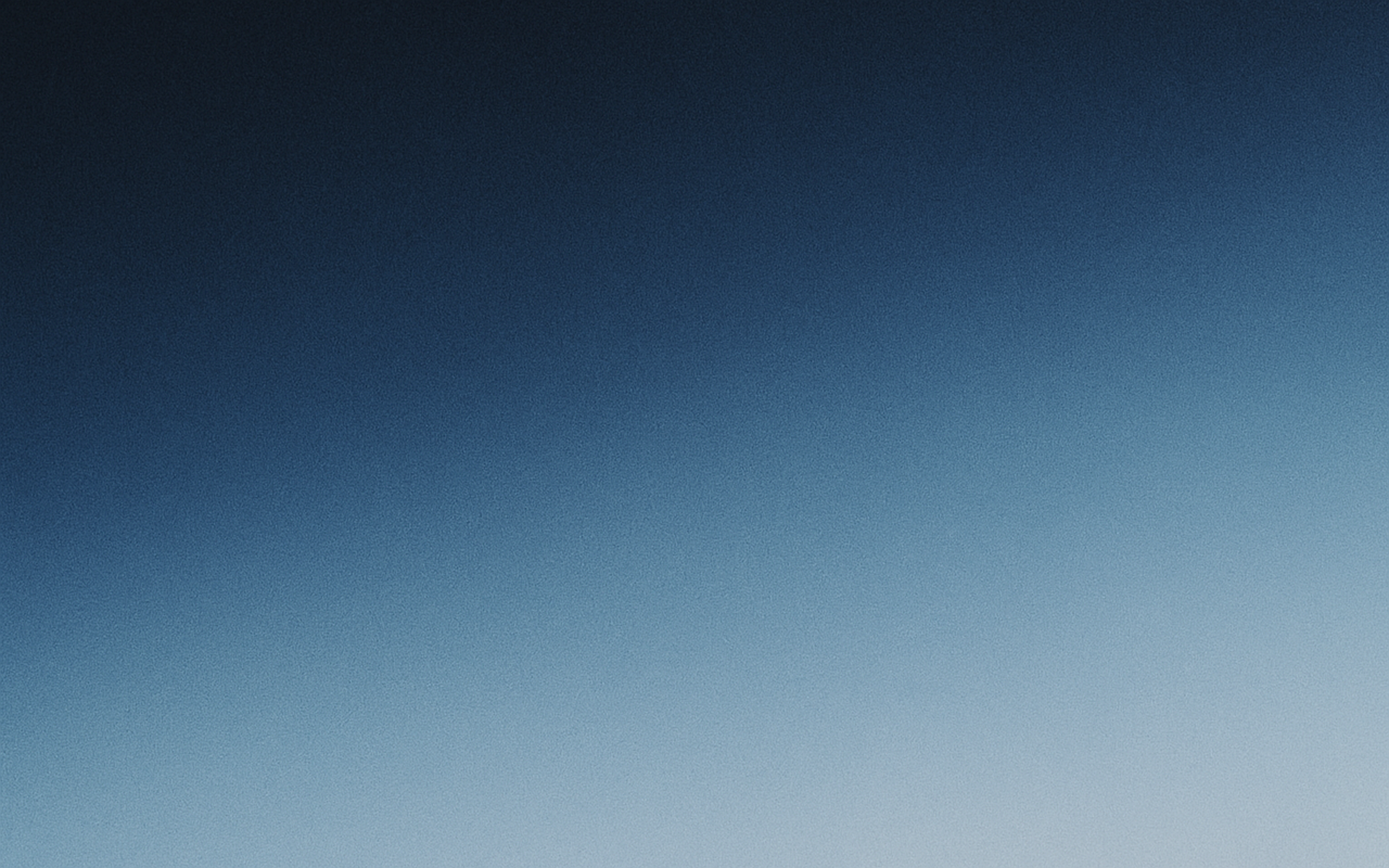 Grainy gradient shifting from deep navy to pale blue